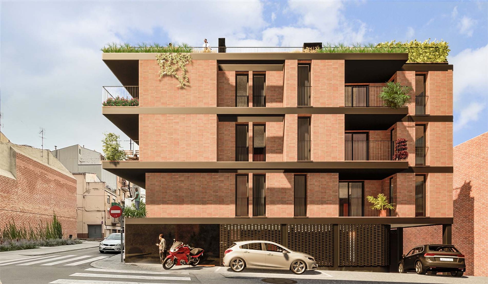 La façana del carrer del Doctor Esteve: el mateix aparell d'obra vista, obertures verticals estretes i balcons als extrems, amb l'entrada del garatge a sota